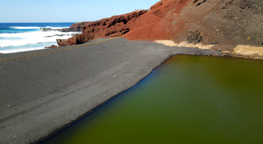 Lakes of Spain: Complete Guide to Natural Beauty & Hidden Gems 11 Charco de los Clicos, Lanzarote with the sea waves.